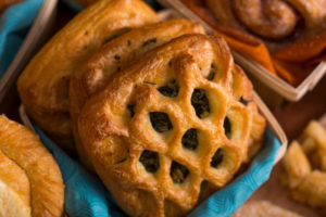 Little Rae's Bakery Spinach Feta Croissants shown in a basket.